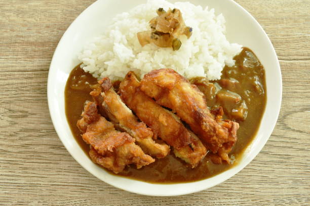istock deep fried chicken dressing with Japanese curry on rice topping slice pickled cabbage 1222736799