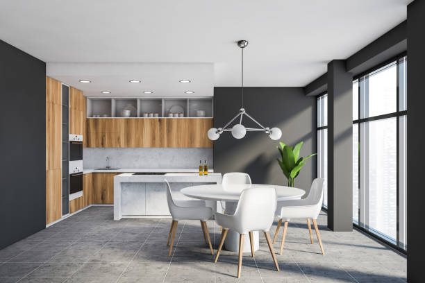 istock Grey and wooden kitchen with island and table 1222738890