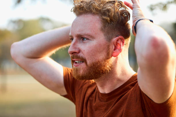 istock Young man exercising / stretching in urban park. 1222738928