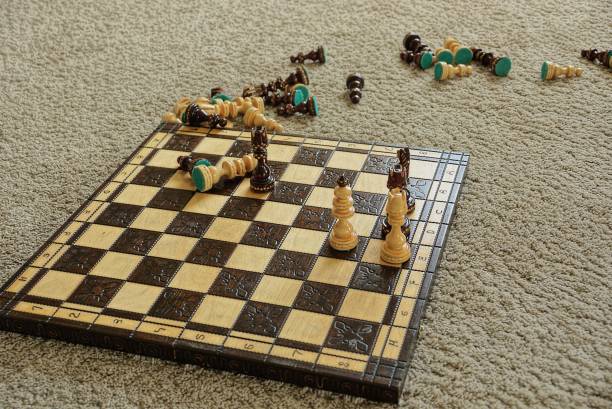 istock wooden chessboard with chess pieces 1222739643