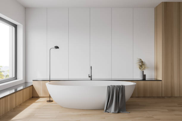 istock White and wooden bathroom interior with tub 1222740271