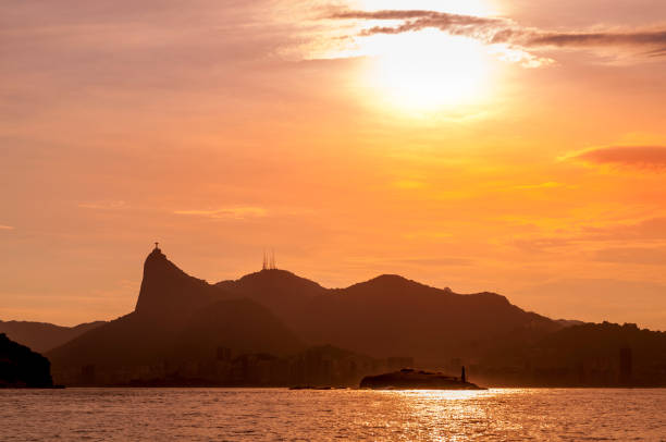 Rio de Janeiro Brazil Sunset behind the mountains of Corcovado, in Rio de Janeiro corcovado stock pictures, royalty-free photos & images