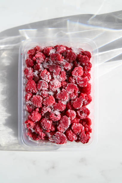 frozen raspberry texture close up for background and your text