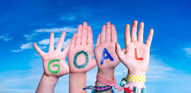istock Children Hands Building Word Goal, Blue Sky 1222740925