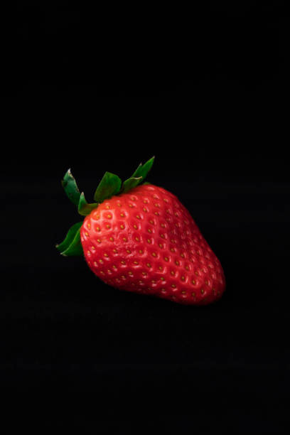 istock Strawberry with strawberry leaf on black background 1222742349