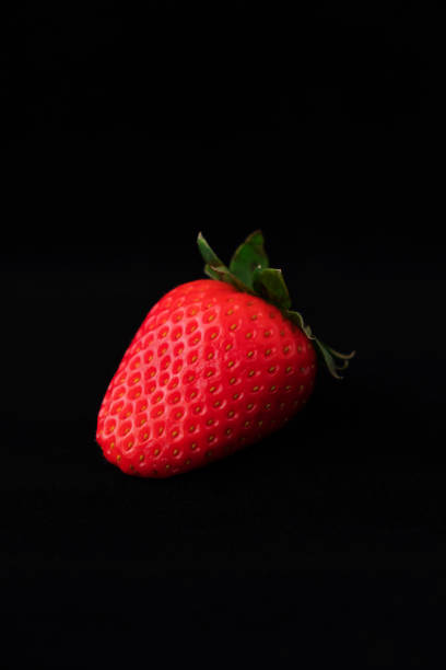 istock Strawberry with strawberry leaf on black background 1222742355