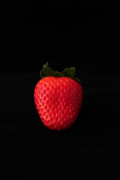 istock Strawberry with strawberry leaf on black background 1222742357