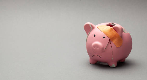 istock Broken piggy bank with band-aid 1222742465
