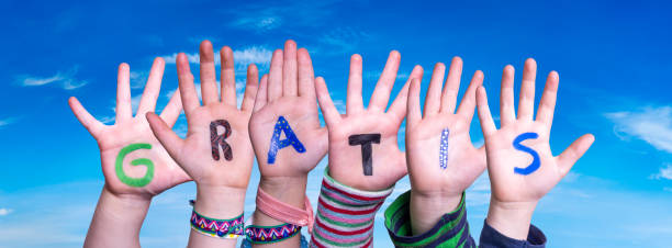istock Children Hands Building Word Gratis Means Free, Blue Sky 1222742493