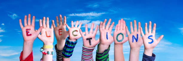 istock Children Hands Building Word Elections, Blue Sky 1222742543