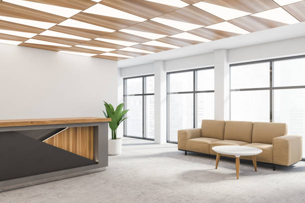 istock Gray reception desk and sofa in white office 1222743603