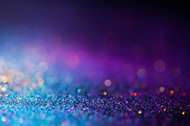 istock Shiny multicolor glitter raster background. Abstract shimmering pink, blue, yellow circles decorative backdrop. Bokeh lights effect illustration. Overlapping glowing and twinkling spots. 1222743942