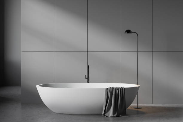 istock Minimalistic gray bathroom interior with tub 1222744363