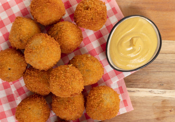 istock Dutch traditional snack bitterbal on a serving board, isolated 1222748179