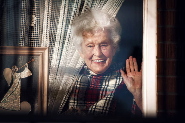 95 years old woman with umbrella waits for better weather