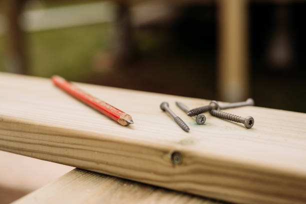 Plank boards construction pen and screws still life