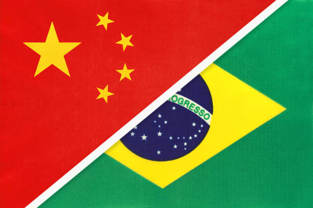 China or PRC vs Brazil national flag from textile. Relationship between asian and american countries. People's Republic of China or PRC vs Federative Republic of Brazil national flag from textile. Relationship, partnership and economic between two asian and south american countries. independence document agreement contract stock illustrations