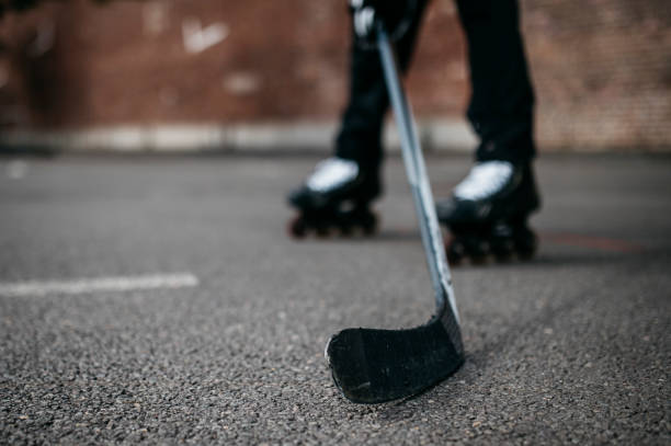 istock Man playing roller hockey outdoor on asphalt 1222752081