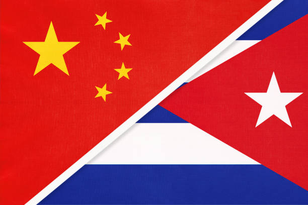 istock China or PRC vs Cuba national flag from textile. Relationship between asian and american countries. 1222752144