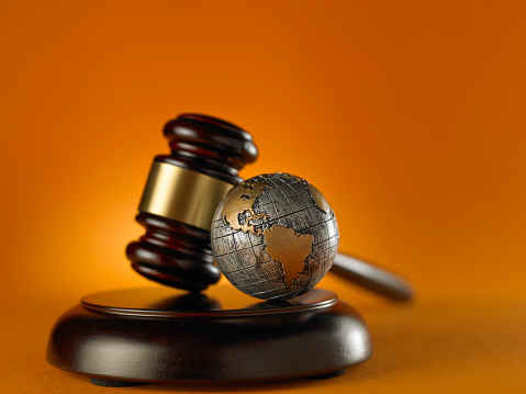 global justice law- law hammer with globe