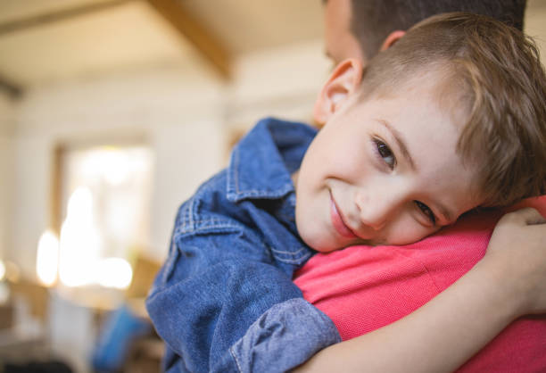 istock Smiling Boy hugging his Father 1222753294