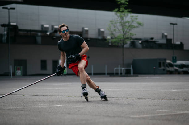 istock Man playing roller skate hockey outdoor on asphalt 1222753540