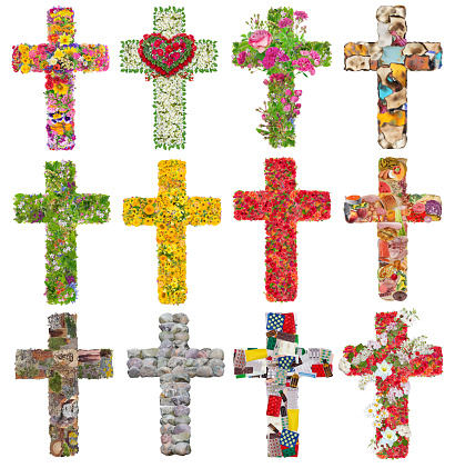 many flowers after a funeral on a grave with a wooden cross