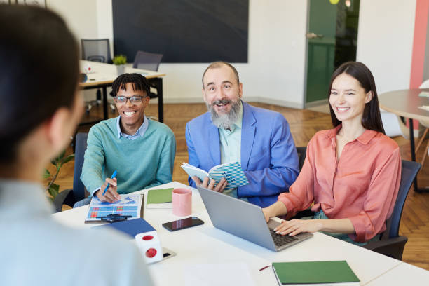 istock Cheerful Office Workers On Meeting 1222755395