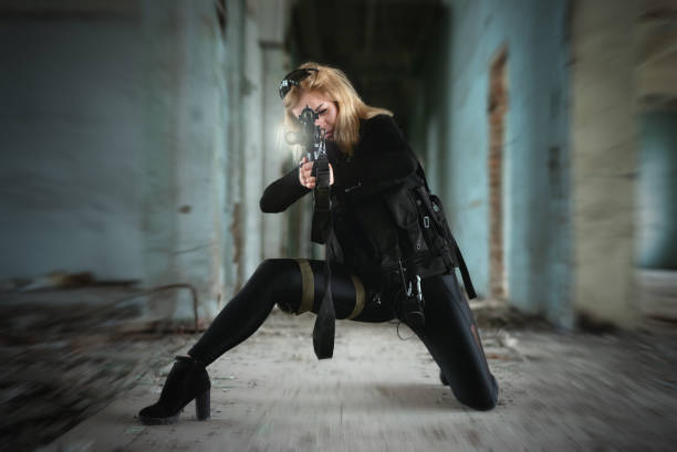 Secret service concept. Special force agent girl with a rifle concept. female sharp shooter stock pictures, royalty-free photos & images