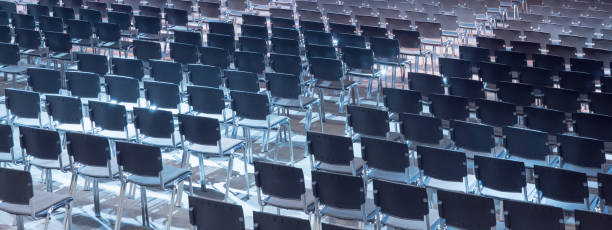 empty seats. equipped conference hall. indoor business conference. interior of a congress hall. cancelled meetings, lectures, lessons, forums due to global disease. online event. web conference. - event convention center business hotel imagens e fotografias de stock