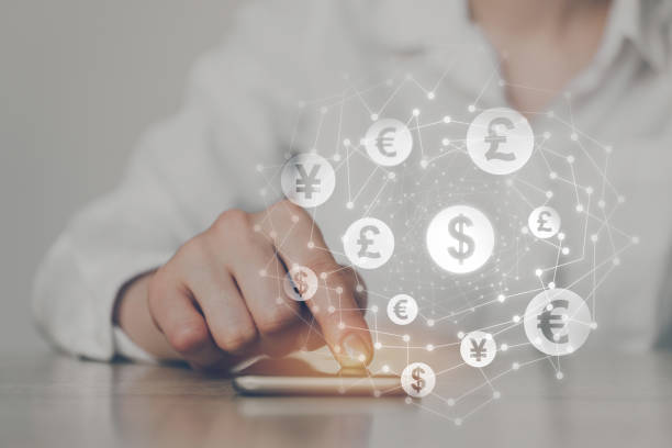 istock ICO concept - hand clicks on smartphone with abstract graphics. 1222757462