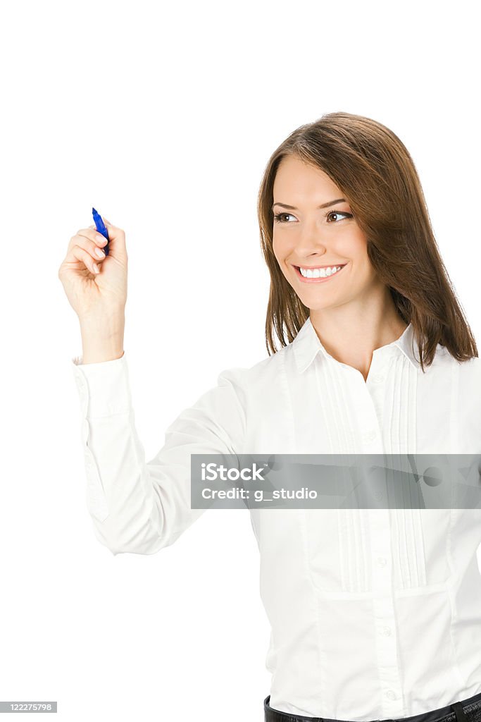 Businesswoman writing or drawing on screen with blue marker, isolated Happy smiling cheerful young business woman writing or drawing on screen with blue marker, isolated on white background Adult Stock Photo