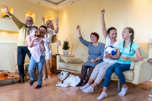istock Cheerful Multi-Generation Family is Supporting National Soccer Team at Home. 1222759601