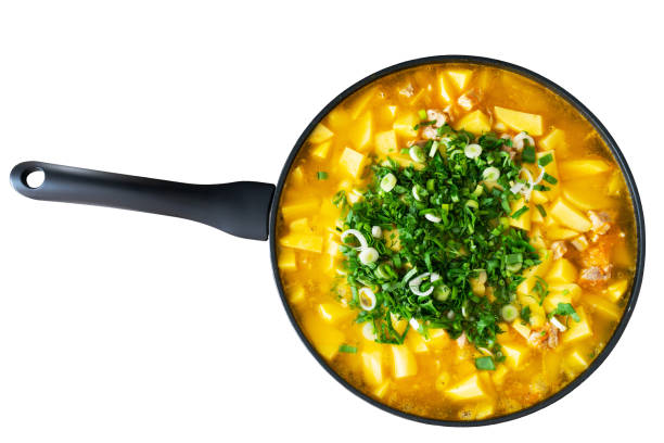 istock stewed potatoes with meat in a frying pan on a white isolated background 1222759775
