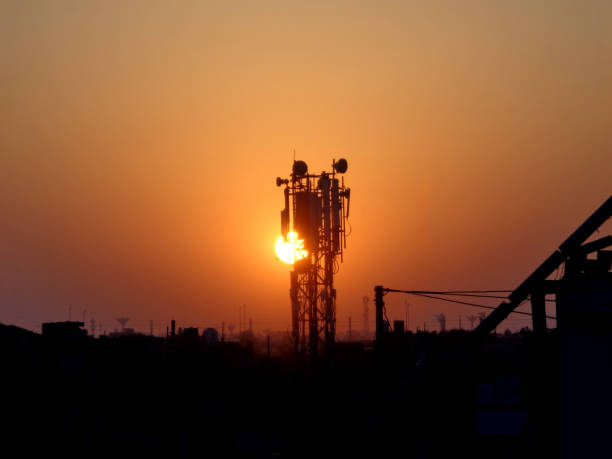 istock silhouette of mobile network tower and cityscape 1222759892