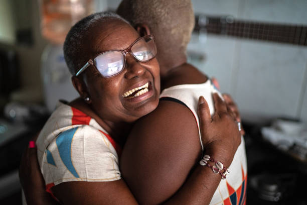 istock Mother and daughter embracing at home 1222761865