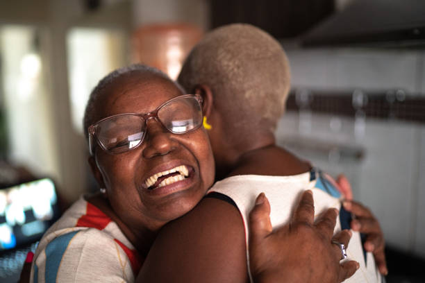 istock Mother and daughter embracing at home 1222762544