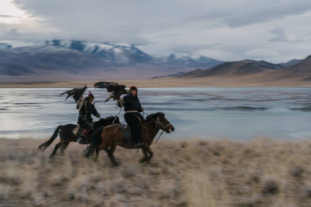 istock Eagle hunters near the river in Mongolia 1222763048