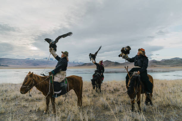 istock Eagle hunters on horses near the river in Mongolia 1222763055