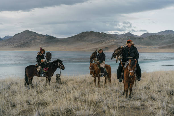 istock Eagle hunters on horses near the river in Mongolia 1222763065