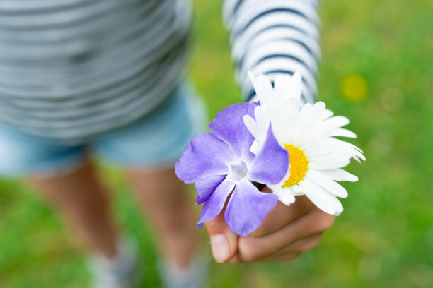 Child holding flowers