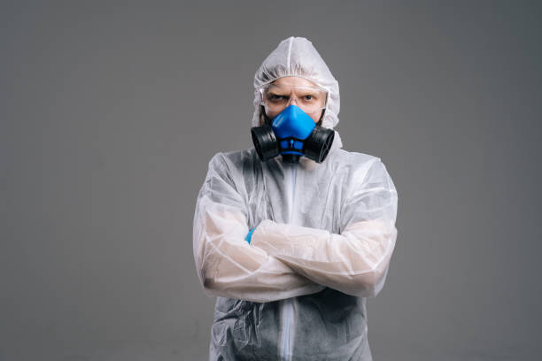 istock Serious epidemiologist worker in protective coveralls, glasses and respirator. 1222764743