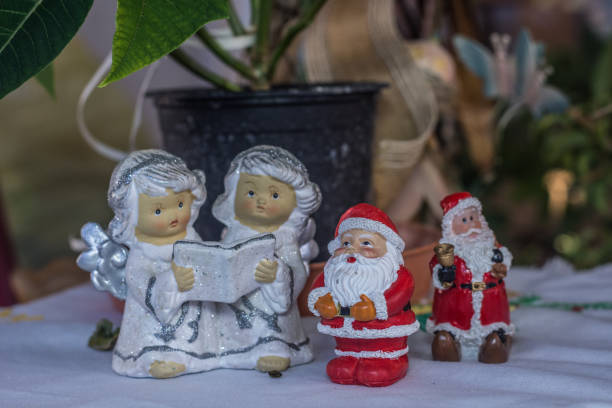 istock figures of angels and santa claus 1222765246