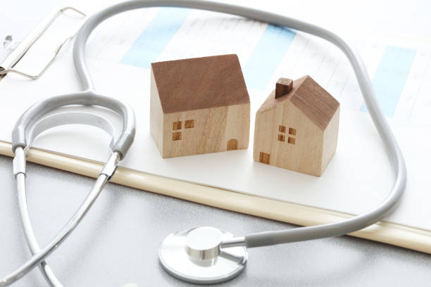istock Miniature house and Medical stethoscope 1222765255