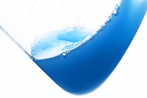 istock Chemistry flask with red and blue liquid 1222765302