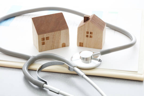 istock Miniature house and Medical stethoscope 1222766051