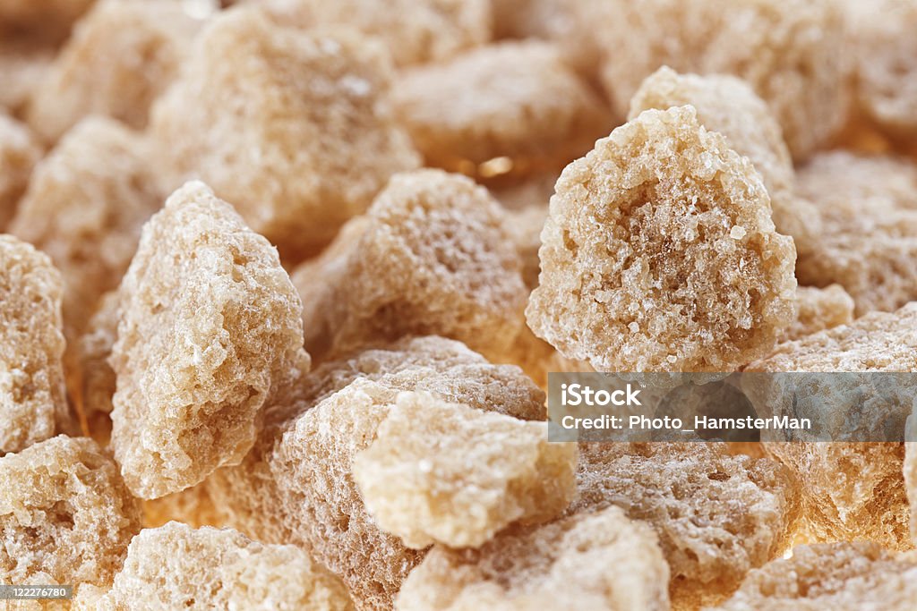 Многие коричневый припухлости трость сахар кубиками, фон - Стоковые фото Куб роялти-фри