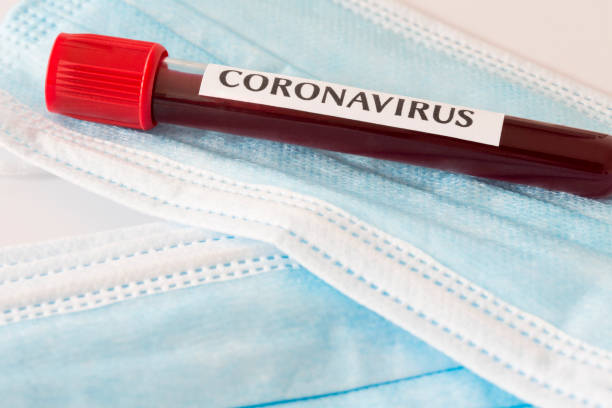istock Coronavirus blood test and protective masks. 1222767924