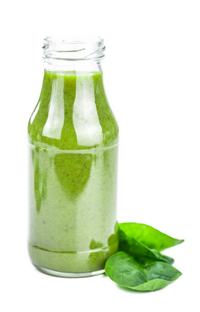istock Homemade spinach smoothie isolated on white (close up; selective focus) 1222768217