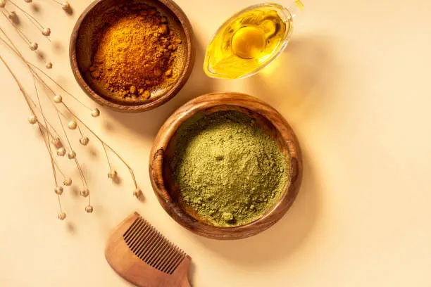 Photo of Henna powder in a wooden bowl